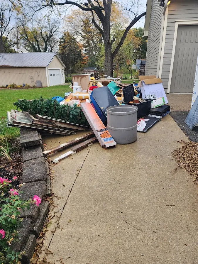 Dumpster being loaded with debris for 12 Yard Dumpster Rental in Dickson City